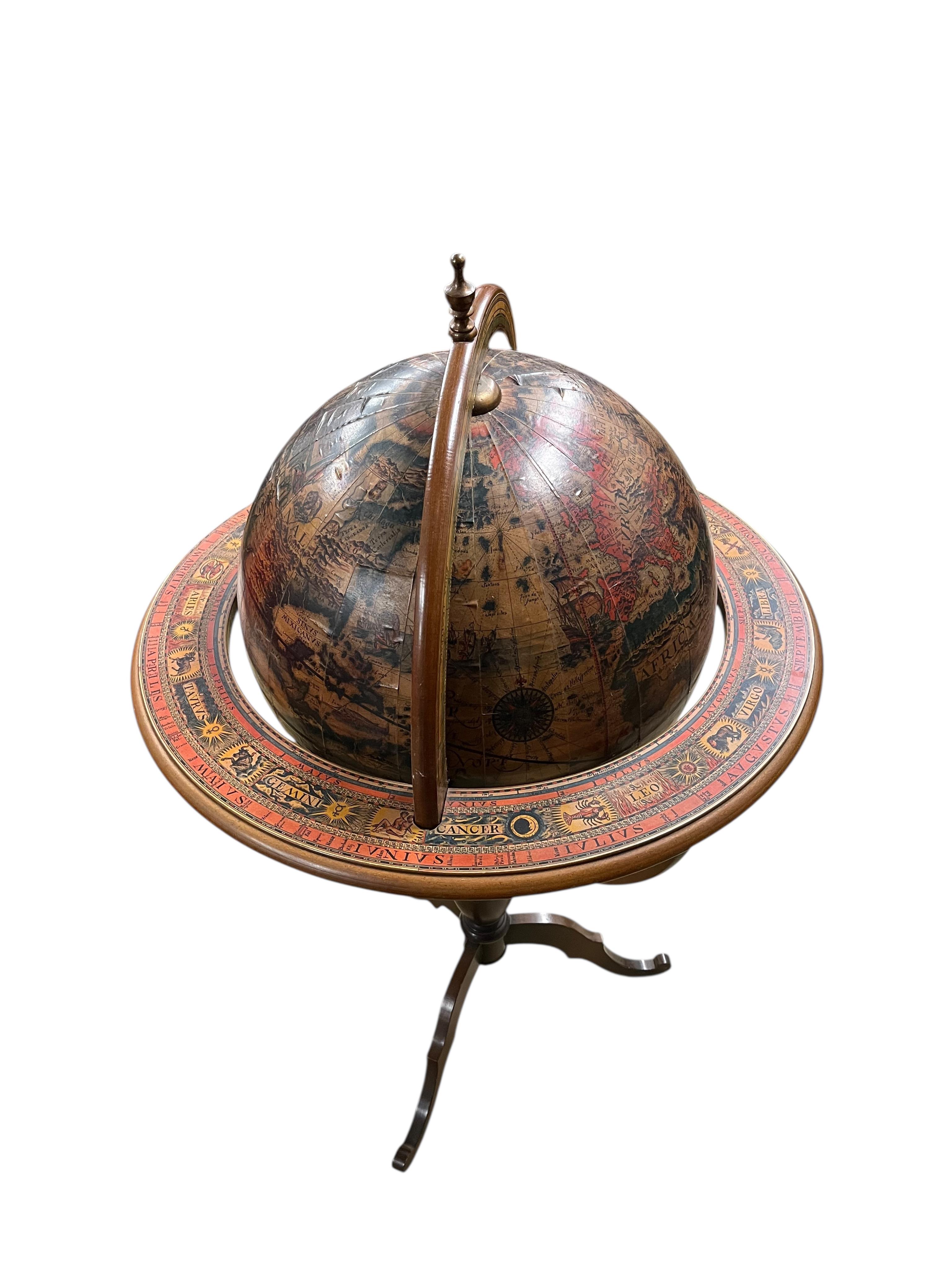 A reproduction terrestrial globe on beech tripod, height 118cm